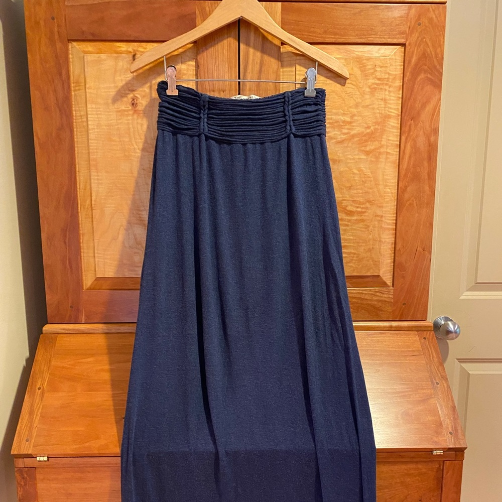 Long dark blue skirt, soft material with textured waist.